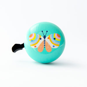A mint bicycle bell with a colorful butterfly design on it, suitable for kids' bikes, trikes, or scooters.