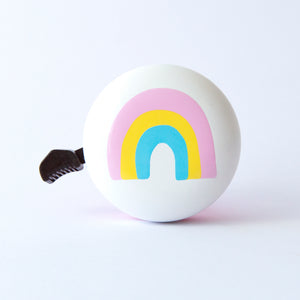 Cute Kids bike bell with pastel rainbow on white and pink bike bell