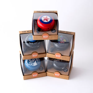 Premium bike bells stacked in recycled packaging