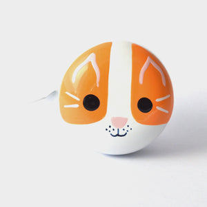 Cute Cat Face on a White Bike Bell