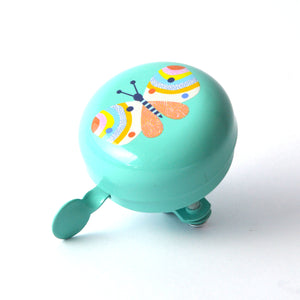 A mint green bicycle bell featuring a colorful butterfly design on the top.
