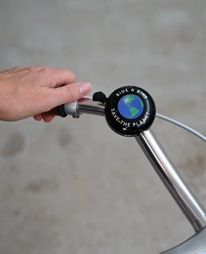 Bike Bell with Ride A bike Save the planet text around an illustration of the earth